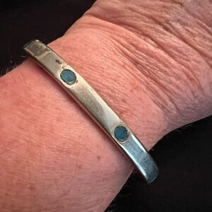 Cuff bracelet with turquoise color insets made in Mexico not sterling